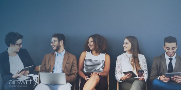 Interviewers talks with group of candidates